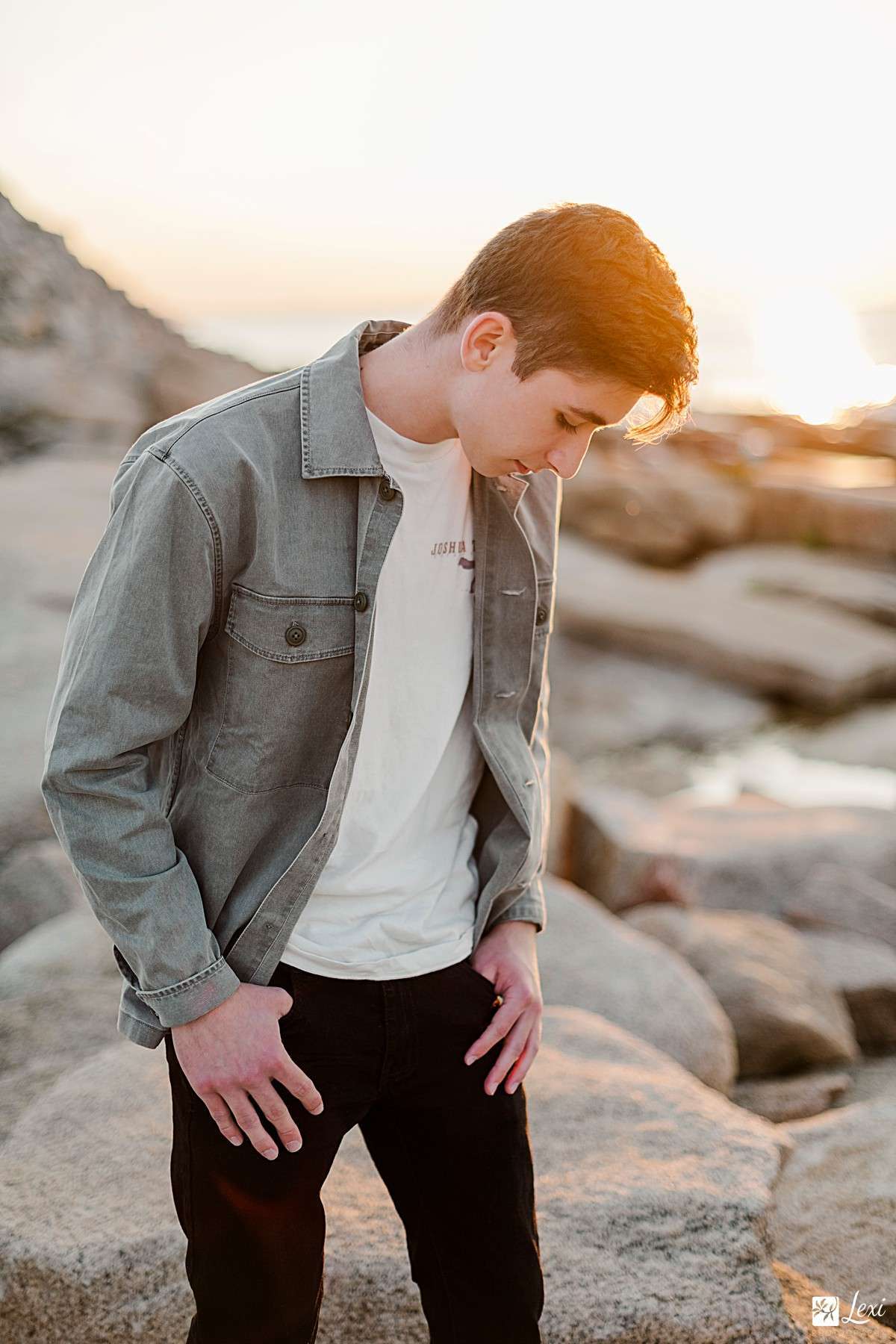 Golden hour beach portrait of a teenage boy, showcasing the dynamic results possible with the 50mm 1.4 lens.