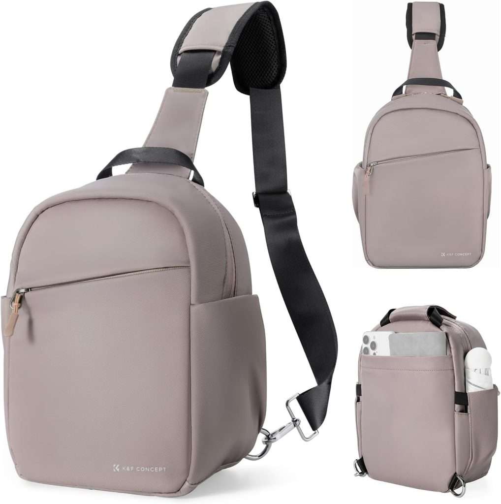 Gray crossbody fabric camera bag with front zipper pocket. 