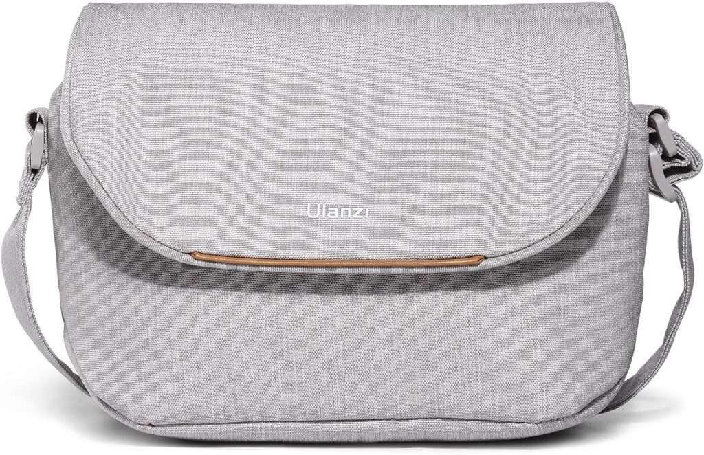 Light gray fabric camera bag with a water resistant fabric.