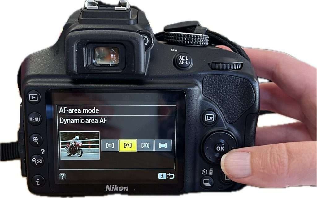 Camera screen showing AF area mode set to "Dynamic-area AF" with multiple focus point icons visible, illustrating focus area selection in camera settings for beginners.