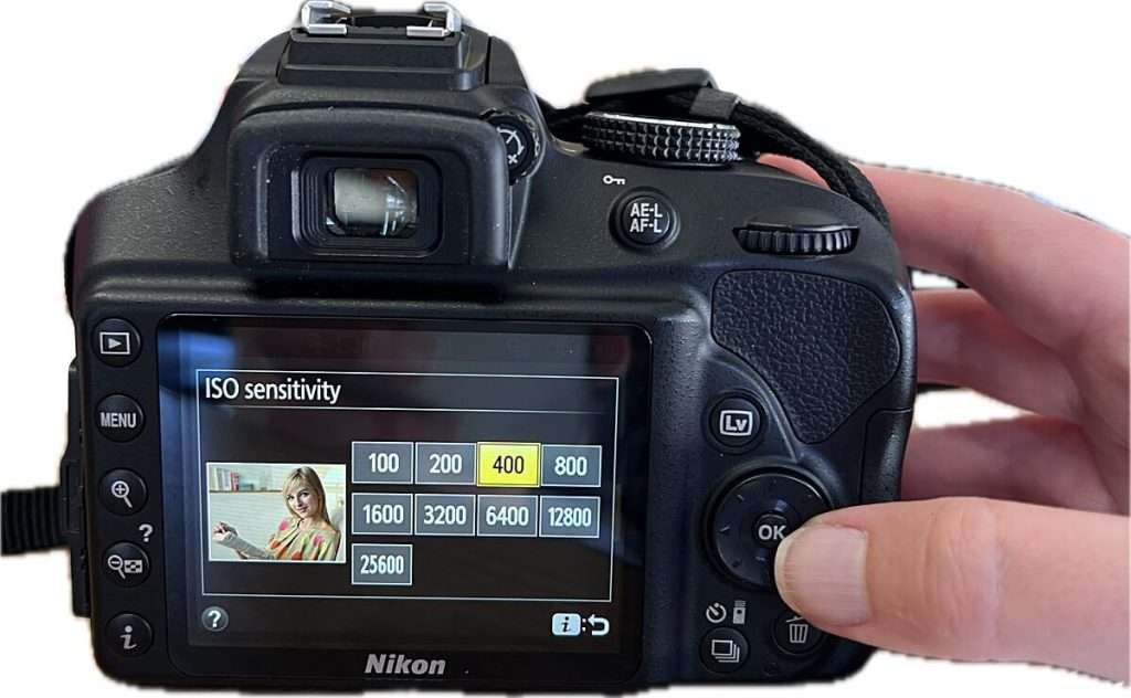 Camera screen displaying ISO sensitivity options with "400" highlighted among values like "100 200 800 1600", demonstrating ISO adjustment in camera settings for beginners.