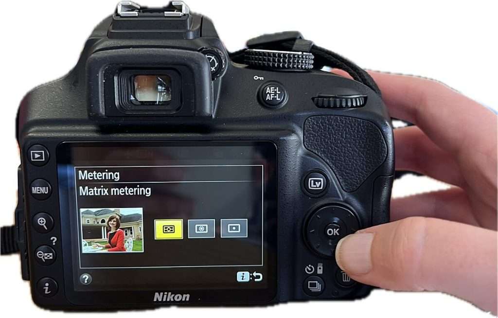 Camera screen showing metering mode set to "Matrix metering" with icon of a person framed in the preview, illustrating exposure metering in camera settings for beginners.